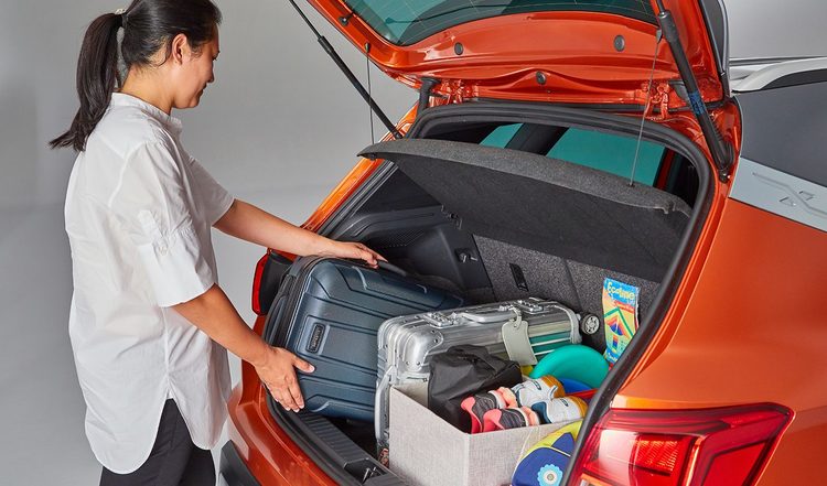 woman loading up boot